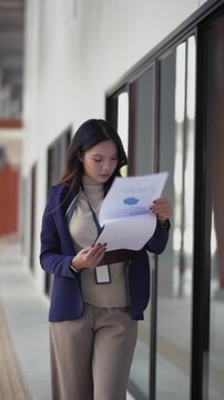 business woman strides along city streets outdoors during her busy workday