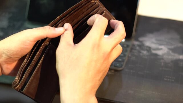 man check an wallet, hope singel penny left