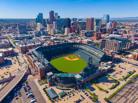 Coors Field aerial view with Denver modern skyline at the back in downtown Denver, Colorado CO, USA. It's the ballpark of MLB's Colorado Rockies. 