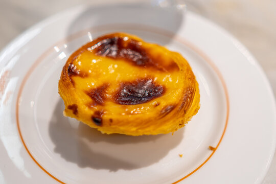 Close up shot of a single traditional Portuguese custard tart