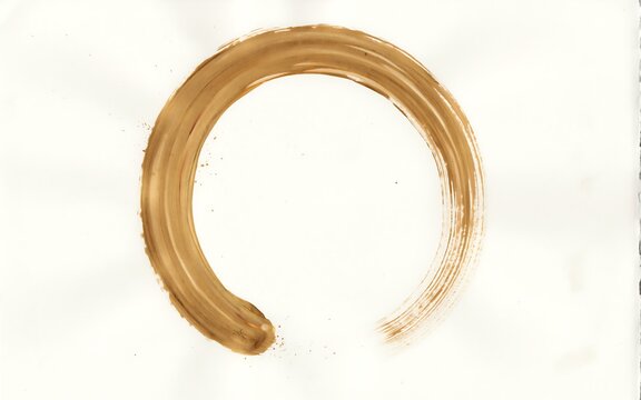 Hand painted golden ink brush stroke circle on a white background