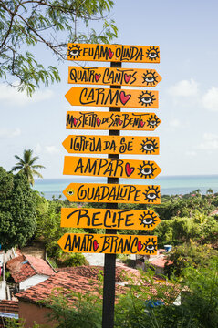Colorful signpost pointing to landmarks in the old town, Olinda, Pernambuco, Brazil