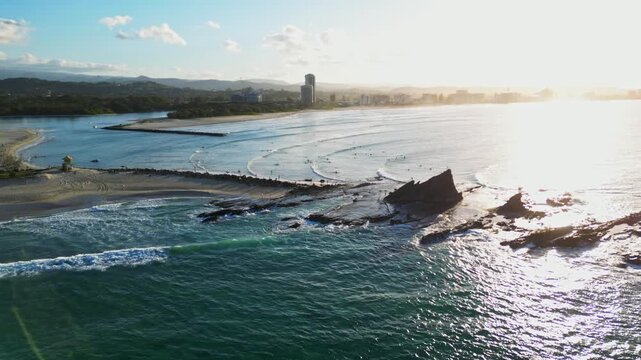 Aerial curve right shot of Currumbin Rock, QLD