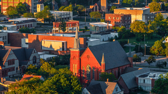 Urban church cityscape at golden hour sunset in Saginaw, Michigan.