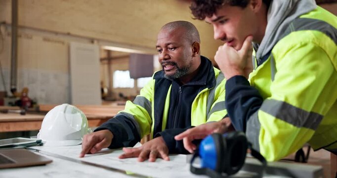 Architect, team and men with blueprint in workshop for construction planning or building strategy. Male people, civil engineer or contractor with floor layout of architecture development or project