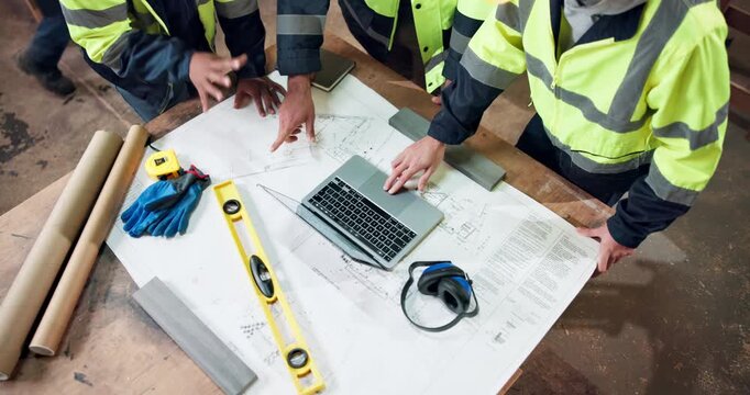 Meeting, above and people with blueprint for construction, planning and layout for building project. Team, engineering and workers with paperwork, laptop and floorplan for renovation or architecture