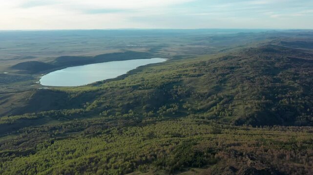Southern Urals in spring: Irendyk ridge and Talkas Lake at sunset.