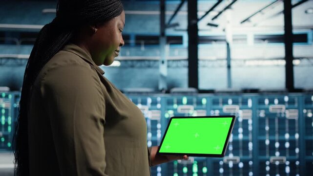Woman stands in a digital media setting where screen content suggests unlimited video access, streaming videos, social media videos and evolving viewing habits across a connected screen experience.