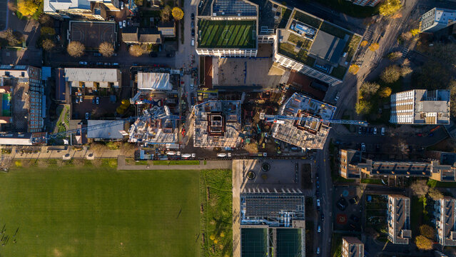Aerial view of the Shoreditch Parkside development construction site featuring tower cranes and ongoing building works adjacent to Shoreditch Park in London, England, United Kingdom.