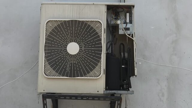 Exterior Air Conditioning Condenser Unit with Exposed Internal Components