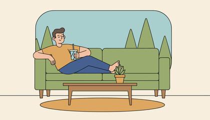 Obraz premium Young man sitting comfortably on a cozy green sofa and drinking a refreshing cold beverage in his modern living room.