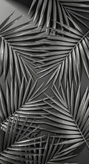 Fototapeta premium Close-up of silver palm fronds arranged in a radial pattern on a dark surface, symbolizing nature, elegance, and tropical themes