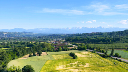 Fototapeta premium Aerial View of Piedmont Farmland and Distant Alps Mountains in Italy