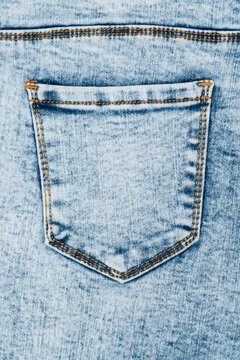 Light blue acid wash denim texture with back pocket detail