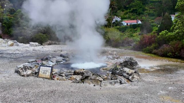 Active geothermal fumarole releasing dense steam in Furnas on Sao Miguel Island Azores Portugal surrounded by volcanic rocks mineral deposits and unique geothermal landscape