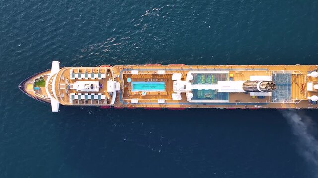 Luxury cruise liner at sea enters scenic harbor during Mediterranean summer holiday