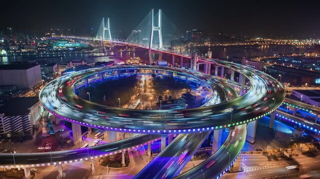  Cityscape time lapse of Nanpu bridge illuminated at night with neon lights, with evening time rush hour commuters 