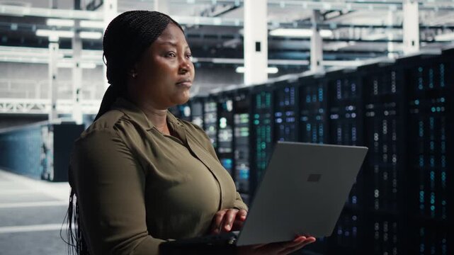 Engineer works inside a data center to support equipment checkups, network monitoring, workload capacity and organized technical operations within a practical data center workflow.