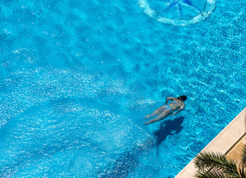 A girl swims in a pool at a hotel in Palma de Mallorca, Spain.