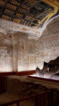 Broken stone sarcophagus of an ancient Egyptian pharaoh Ramesses inside a royal burial chamber of royal tomb KV 9, Valley of the Kings, Luxor, Egypt.