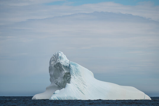 Majestic iceberg floats in the vast ocean off coast of Newfoundland