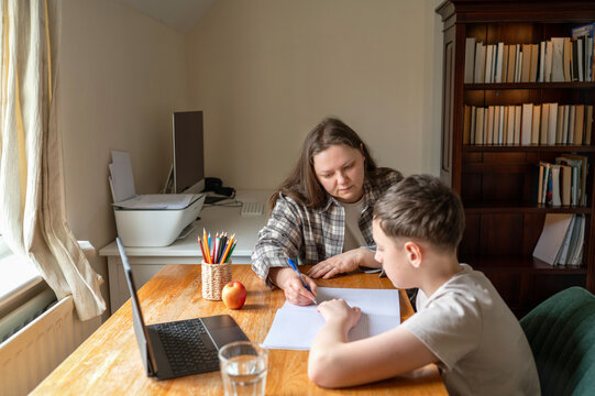 Parent assisting child with home education and schoolwork