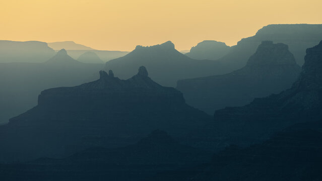 Hazy desert canyon layers at golden hour