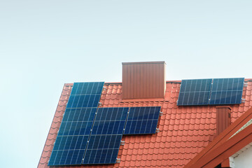 Fototapeta premium Solar panels covering full roof of modern eco home