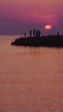 Family on pier fishing at sunset tilt up shot reveal