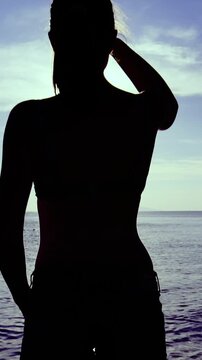 Person silhouette at the sea zoom out