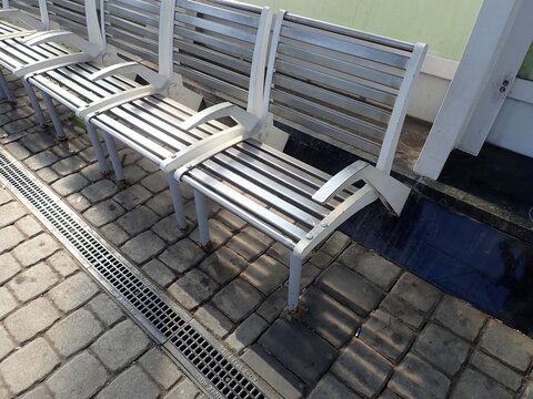 city bench in park in urban area