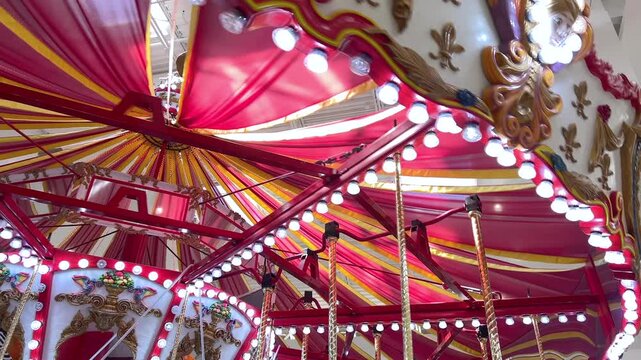 Close view carousel roof with vibrant illuminated panels