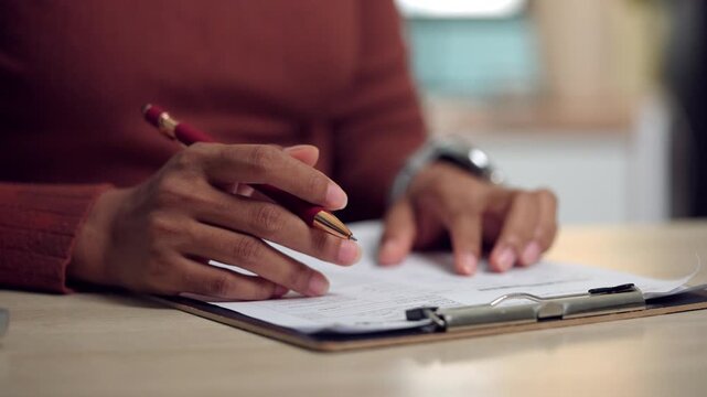 Close-up image of a businesswoman signing agreement papers with a pen, representing partnership, approval, legal procedure, and business commitment. Ideal for corporate and administrative concepts.
