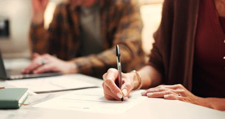 Hands, documents and couple with writing, insurance and financial decision in home. Man, woman and application with signature, planning or policy for budget and premium or safety for asset management © peopleimages.com