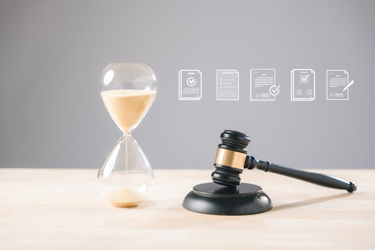 Hourglass and legal gavel symbolize justice law time court deadline, representing important documents contracts invoices agreements for lawyer judge review