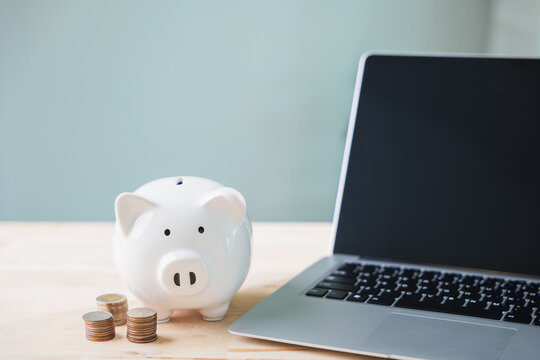 piggy bank learning e education, online money elearning internet, financial savings on wooden table with laptop for tuition, budget for digital skill training and online courses