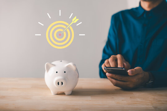 Digital savings mobile payment through bank app, person uses smartphone to manage finance, reaching piggy bank financial goal with online save technology for future investment success