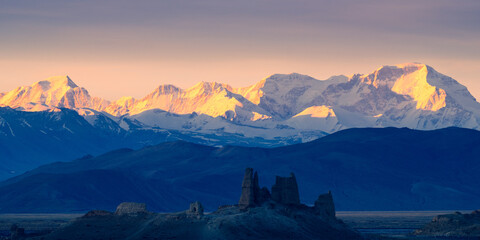 The first rays of the morning sun illuminate Cho Oyu and a historic earthen fortress built during the Chinese Qing dynasty to defend Tibet's southern frontier. © Haomin Li