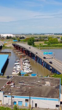 Vertical View Of Traffic Over The Sea Island Bridge In Richmond, British Columbia, Canada. Aerial Shot
