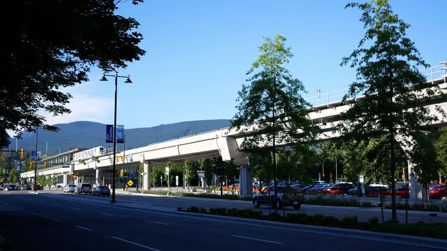 Modern Automated Rapid Transit SkyTrain Moving on Elevated Rail in Vancouver Area