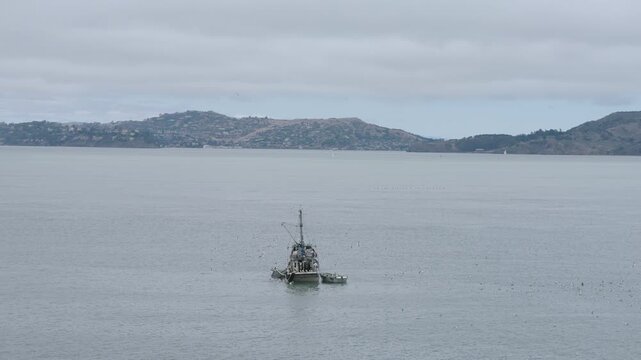 Commercial Fishing Vessel Underway San Francisco Bay Near Alcatraz Island - Aerial Shot Getting Farther Away