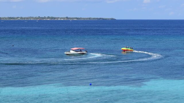 people like to have fun on banana boats on the sea