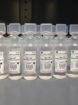 Row of Otsuka brand Sterile Water for Injection Vials in Plastic Ampoules 25 ml for Medical and Laboratory Use