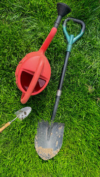 Garden tools on vibrant lawn in soft daylight suitable for gardening blog DIY tutorial landscape design social media and product catalog use, 5 May 2026 Subitica, Serbia
