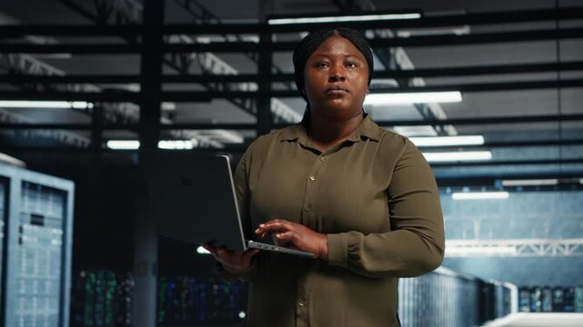 System administrator reviews power management in a data center, supporting system stability and network monitoring.
