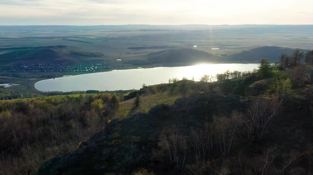 Southern Urals in spring: Irendyk ridge and Talkas Lake at sunset.