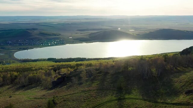 Southern Urals in spring: Irendyk ridge and Talkas Lake at sunset.