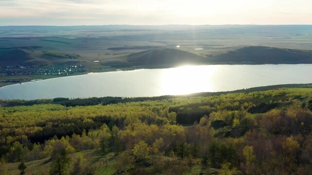 Southern Urals in spring: Irendyk ridge and Talkas Lake at sunset.