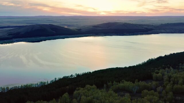 Southern Urals in spring: Irendyk ridge and Talkas Lake at sunset.