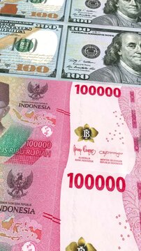 Vertical Dollar and Indonesian Rupiah 100000 Currency Exchange Loop Background Business Finance Motion